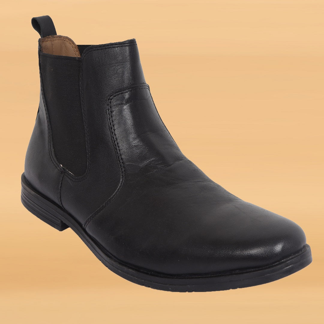 Stylish leather boot highlighting its rich texture and sleek silhouette