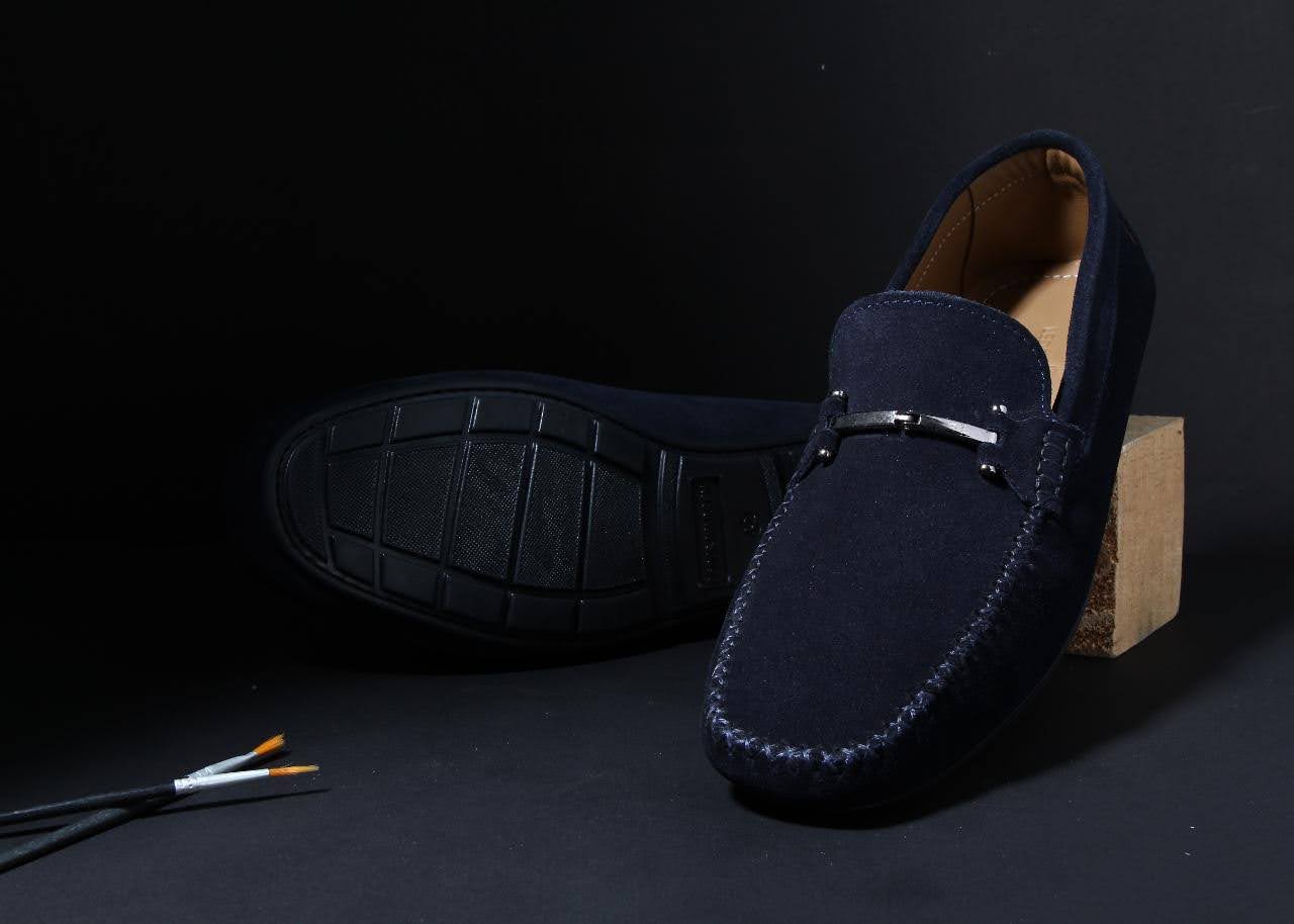 Classic men's leather loafer featuring a sleek silhouette and effortless elegance.